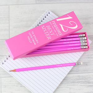 Box of 12 personalised pencils in a pink box. The box has fixed text printed in white which reads '12 reasons' which can be followed by a name and message of your choice which will also be printed in white below that. Inside the box are 12 HB writing pencils with a pink outer and an eraser on the top. Each pencil can be individually personalised with your own reasons why you love someone or other text of your choice.